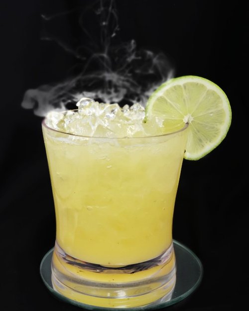 Drink Smoked Lilikoi Caipirinha created by Kay Mohamed